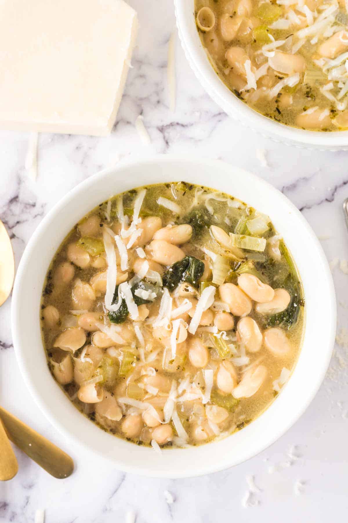 white bean soup in white bowls