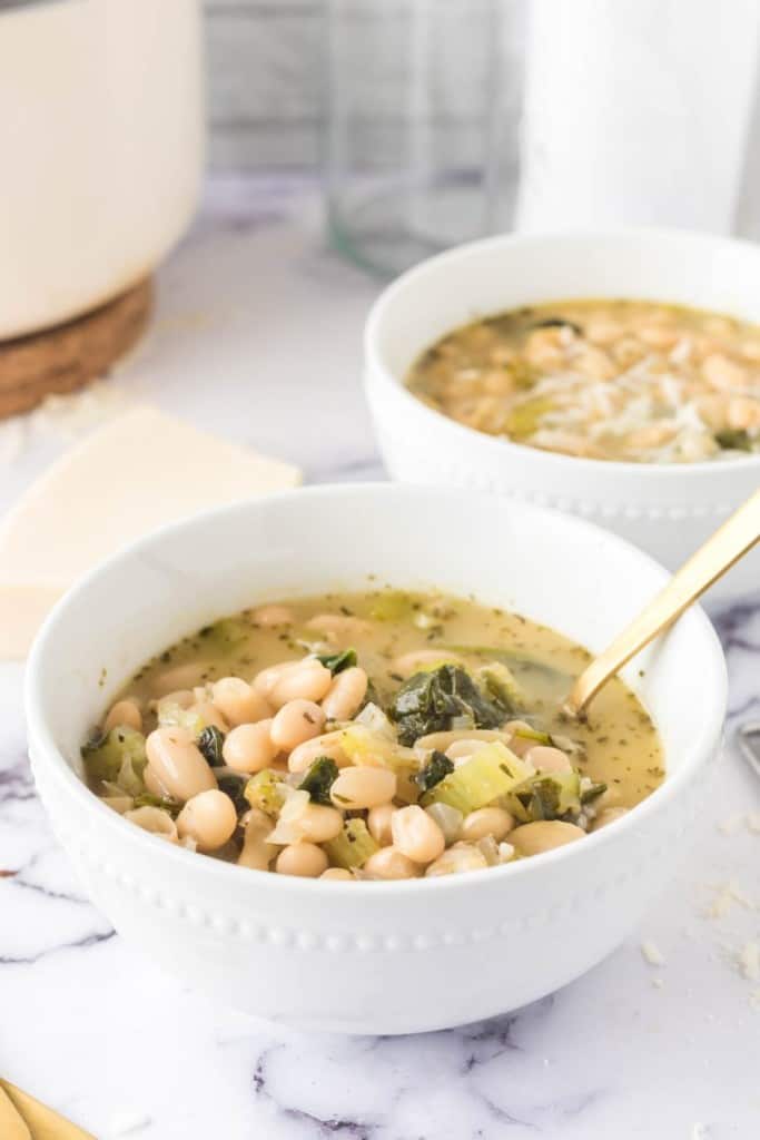 white bean soup in white bowls