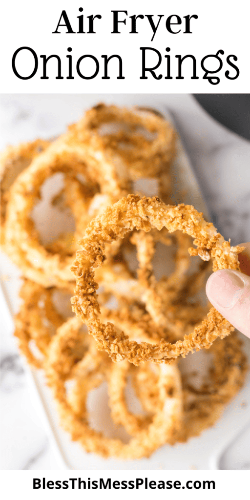 Pin that reads air fryer onion rings with a POV photo holding a ring up close with a plate behind it