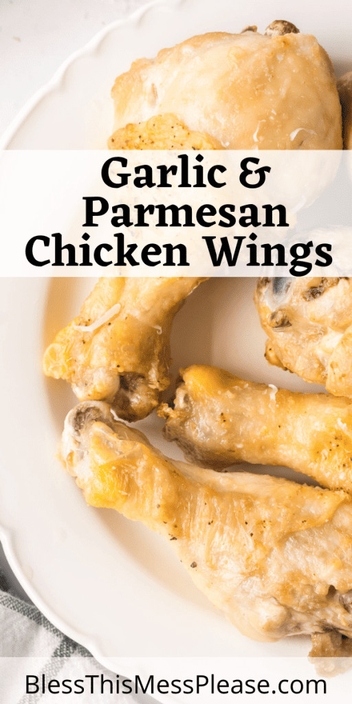 pin that reads garlic parmesan chicken wings with cooked chicken drum sticks with seasoning and cheese