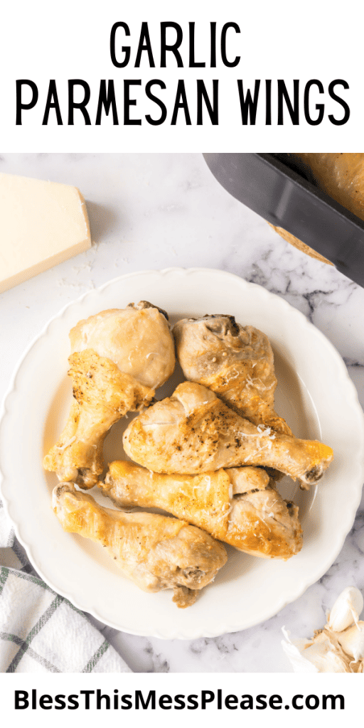 pin that reads garlic parmesan chicken wings with cooked chicken drum sticks with seasoning and cheese