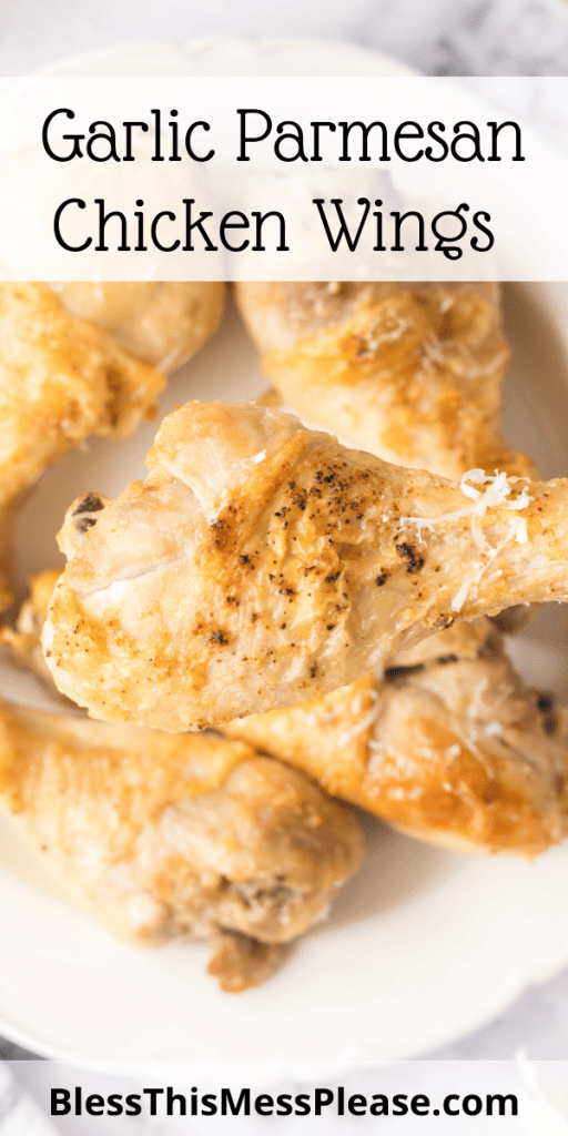 pin that reads garlic parmesan chicken wings with cooked chicken drum sticks with seasoning and cheese