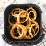 onion rings in the air fryer basket.