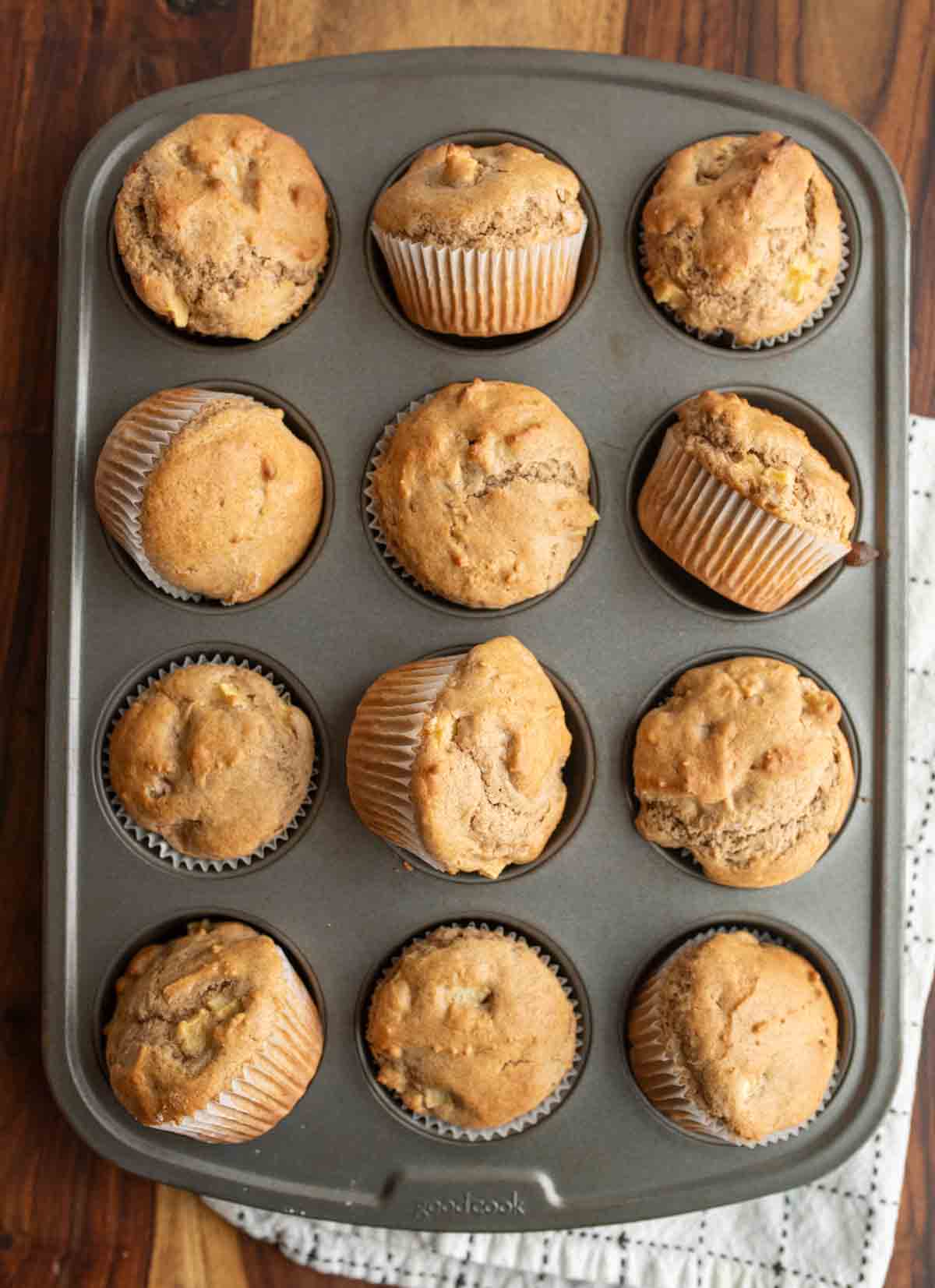 apple cinnamon muffins in a muffin tin