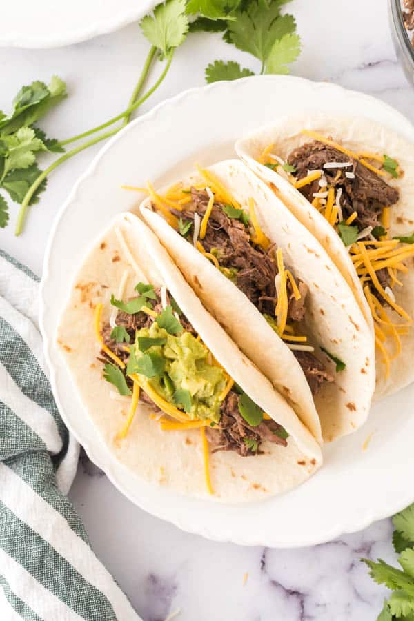 barbacoa tacos on a plate