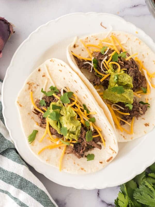 barbacoa tacos on a plate