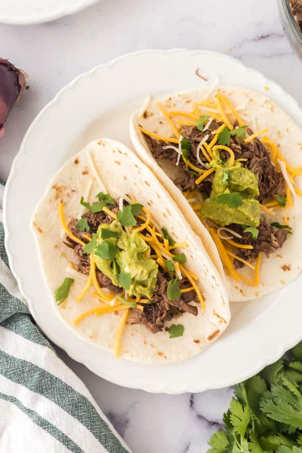 barbacoa tacos on a plate