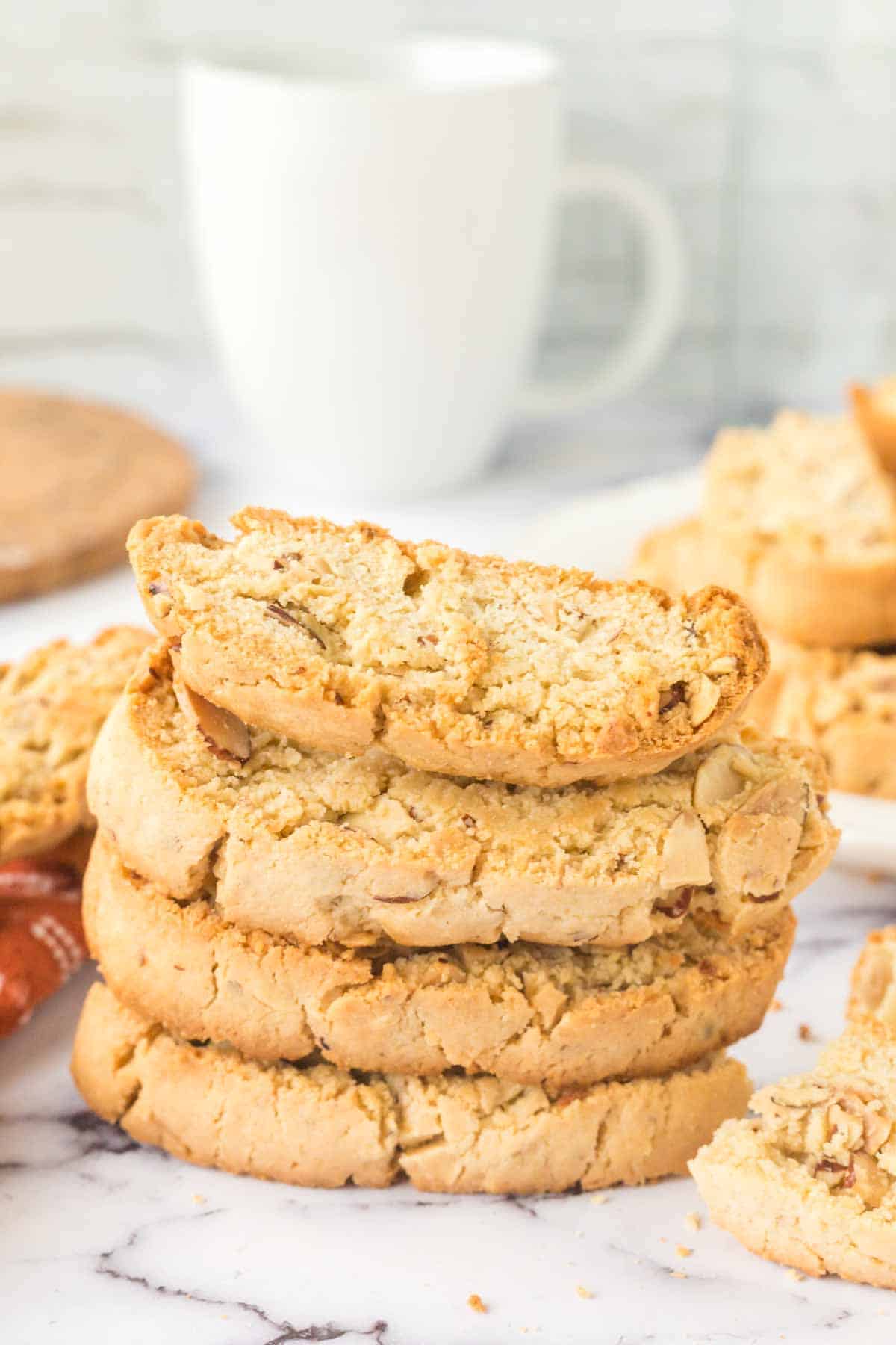 almond biscotti recipe with chocolate dip on the side stacked on a plate
