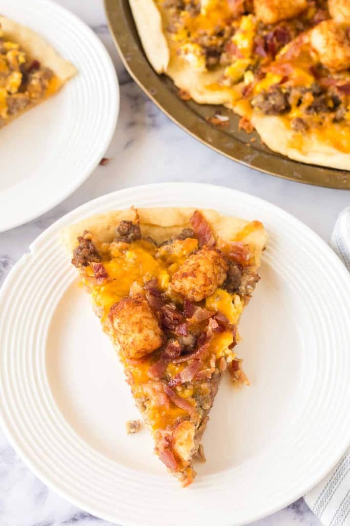 slices of breakfast pizza on a white plate