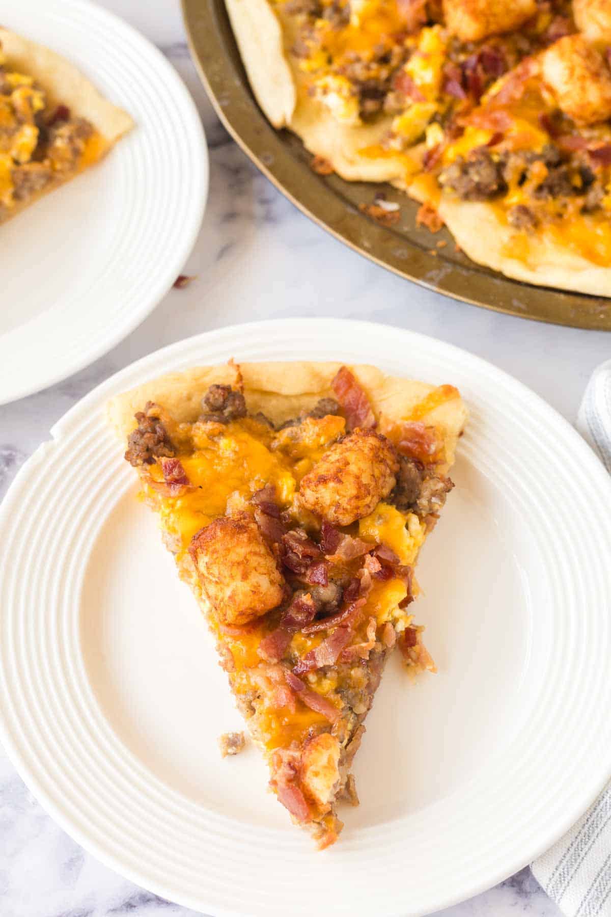 slices of breakfast pizza on a white plate