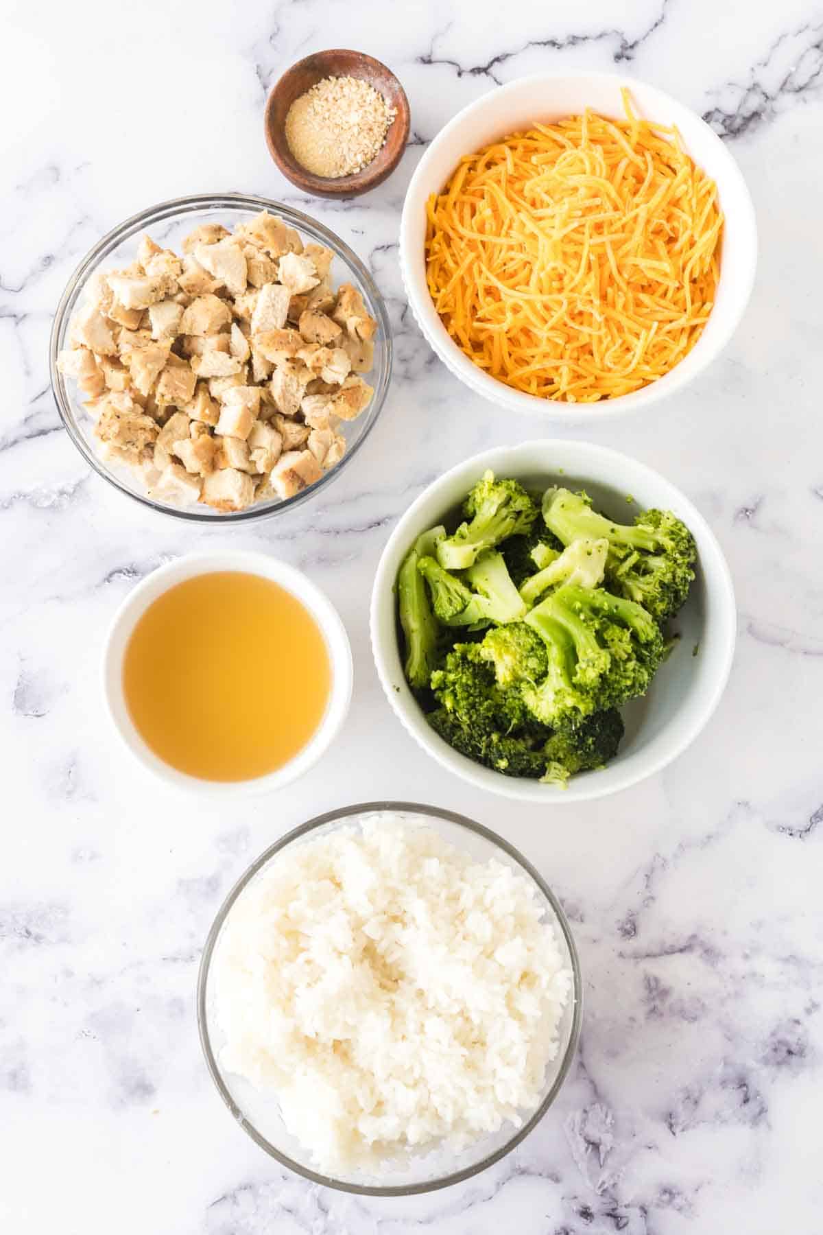 raw ingredients for broccoli rice casserole in portioned dishes