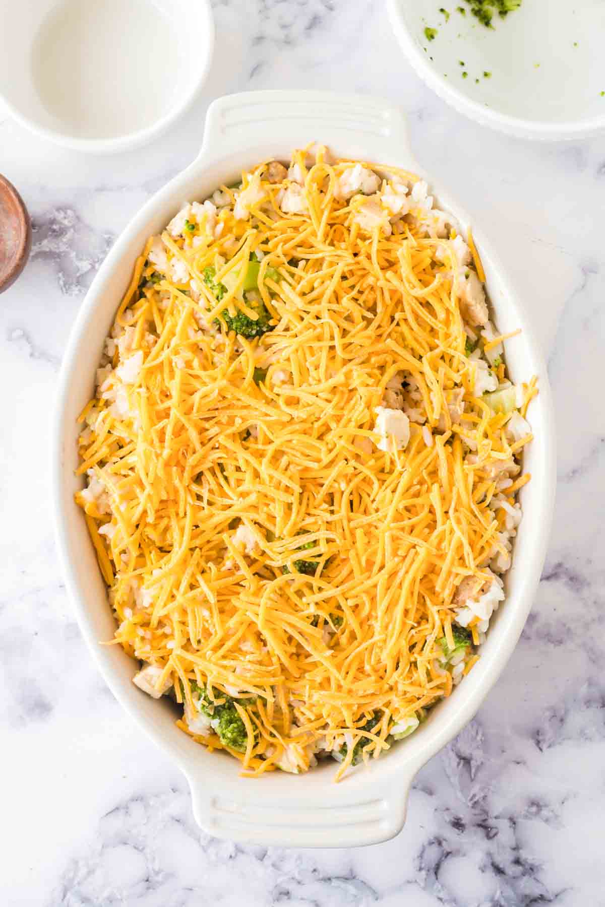 top view of uncooked whole baking dish with chicken broccoli rice casserole