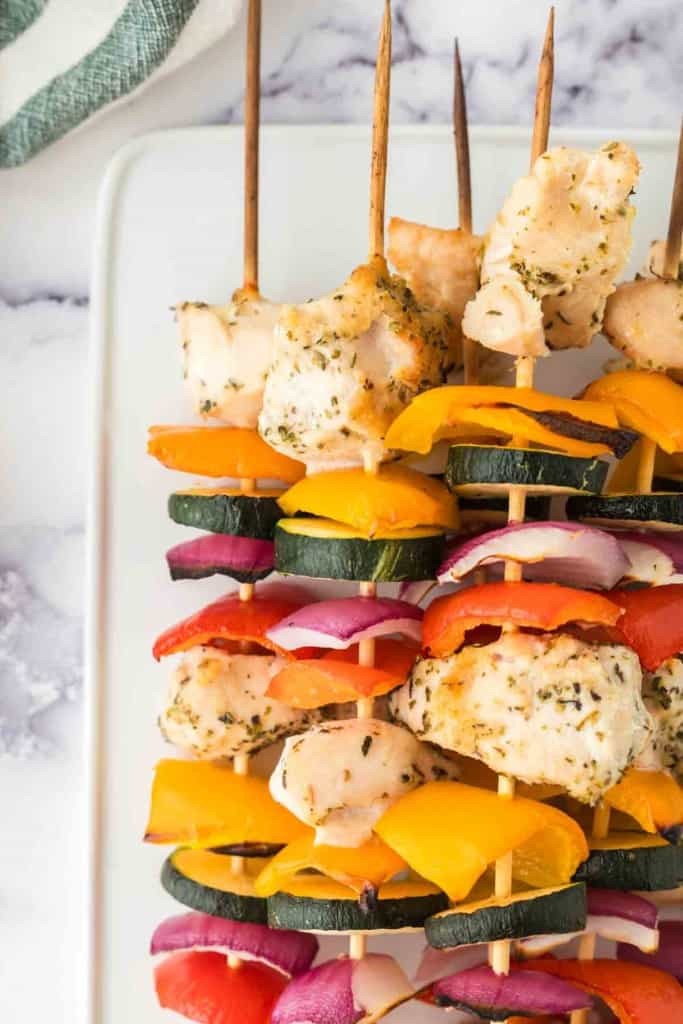 chicken kabobs with skewered chicken zucchini onion and peppers