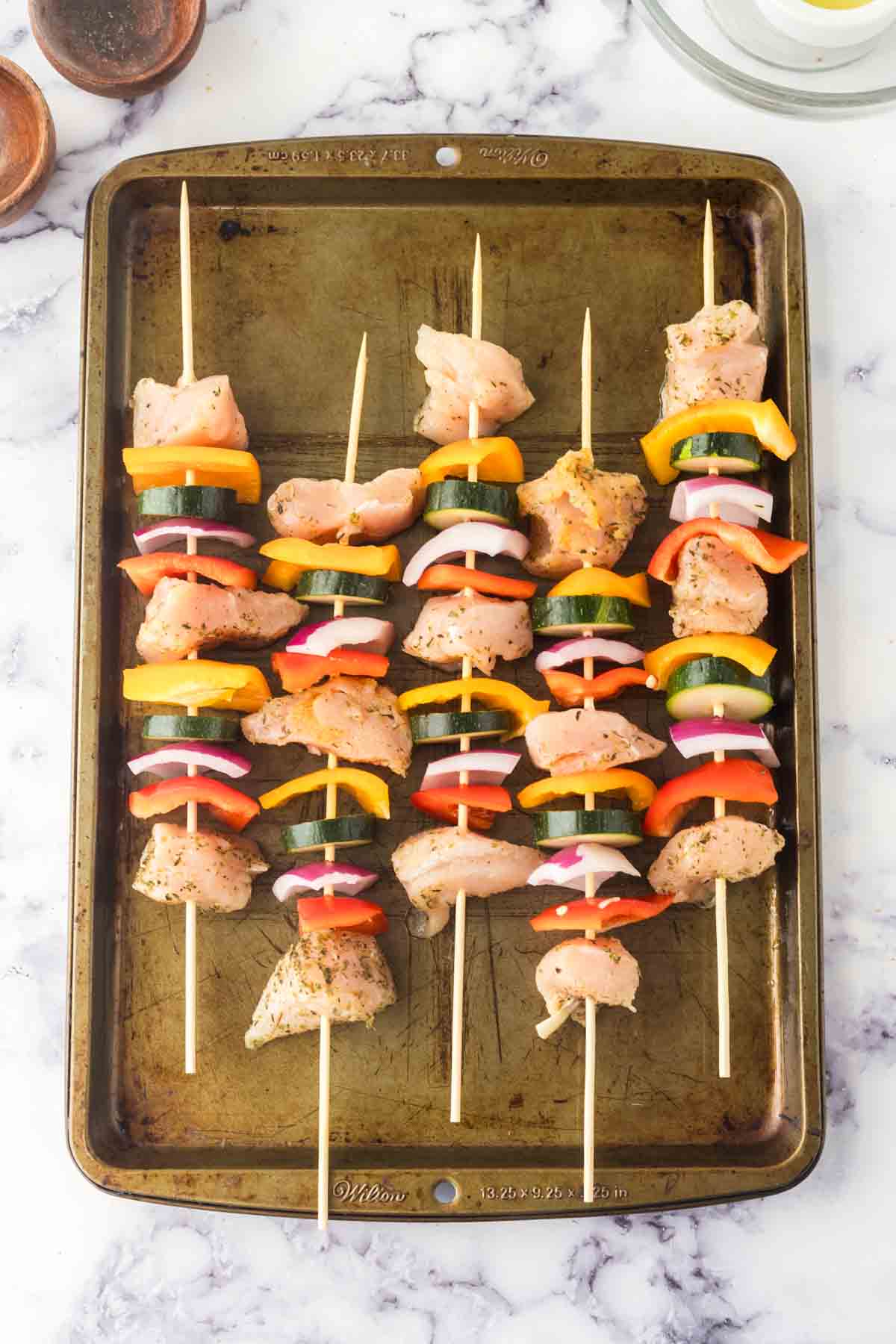 chicken kabobs with skewered chicken zucchini onion and peppers