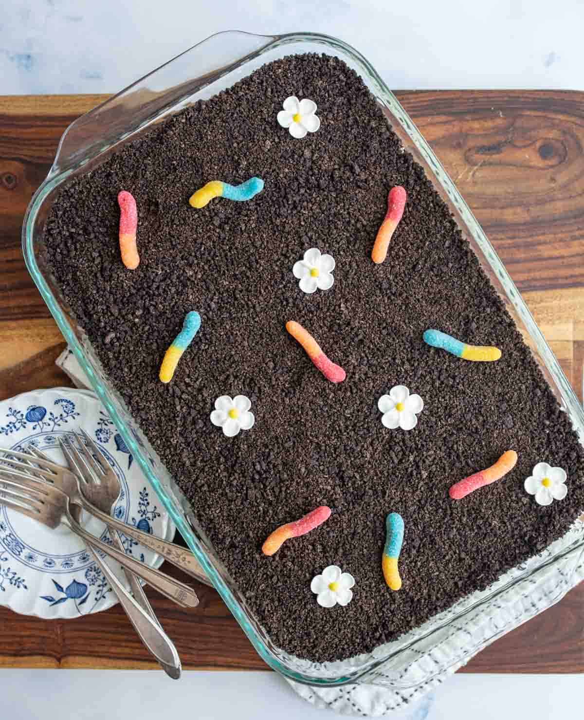Full baking dish of dirt pudding complete with gummy worms.