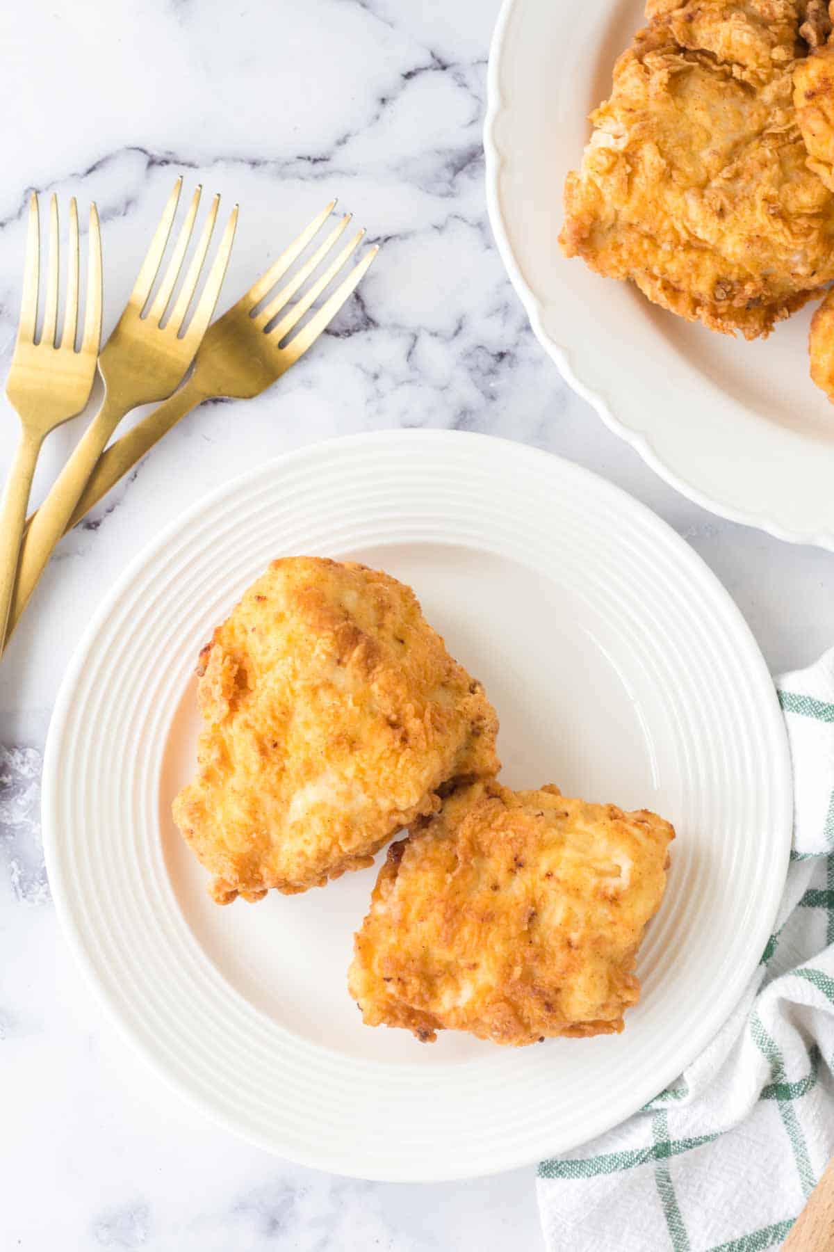 golden and crisp perfectly fried chicken on a plate