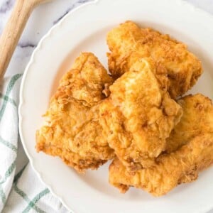 golden and crisp perfectly fried chicken on a plate