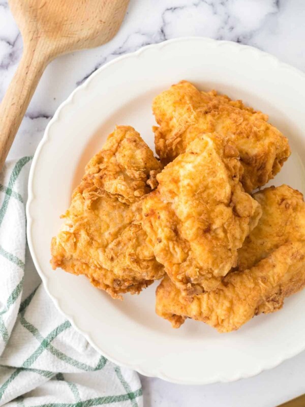 golden and crisp perfectly fried chicken on a plate