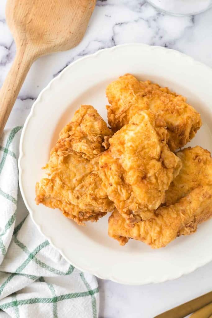 golden and crisp perfectly fried chicken on a plate