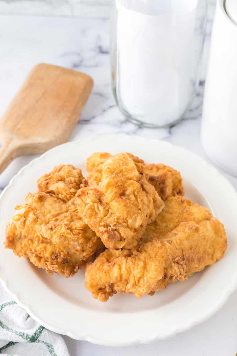 golden and crisp perfectly fried chicken on a plate