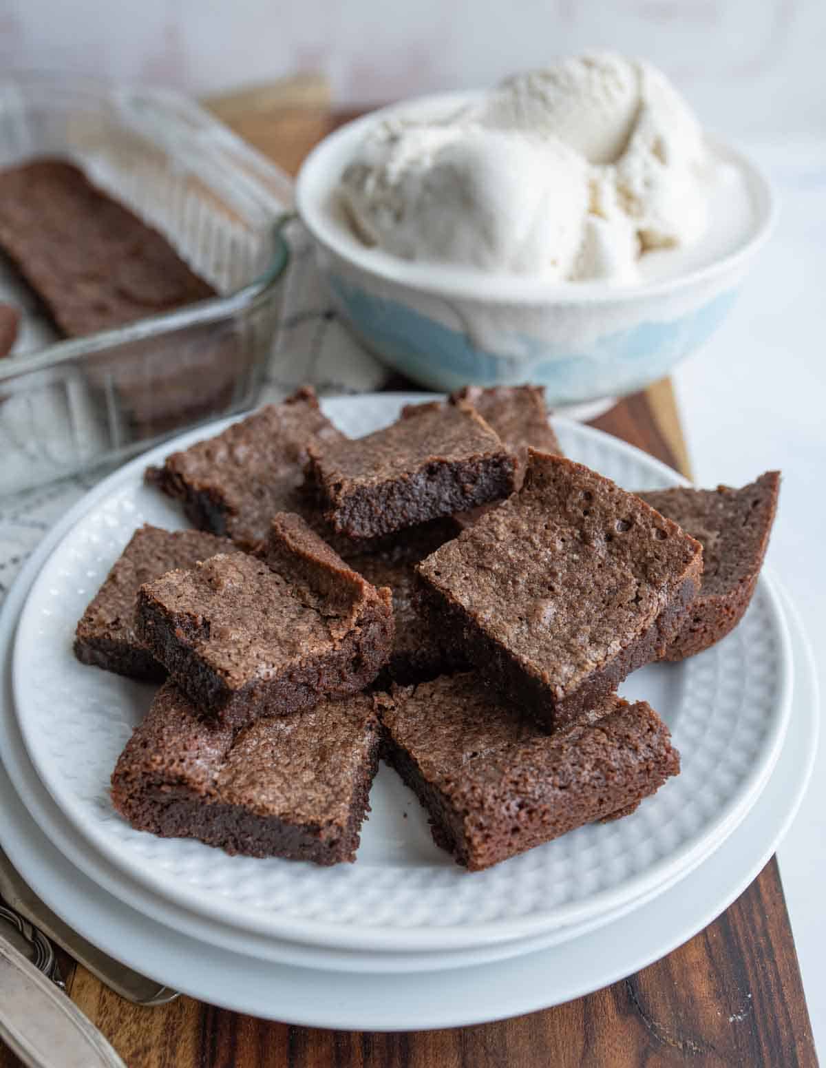 Plate full of fudgy brownies. 