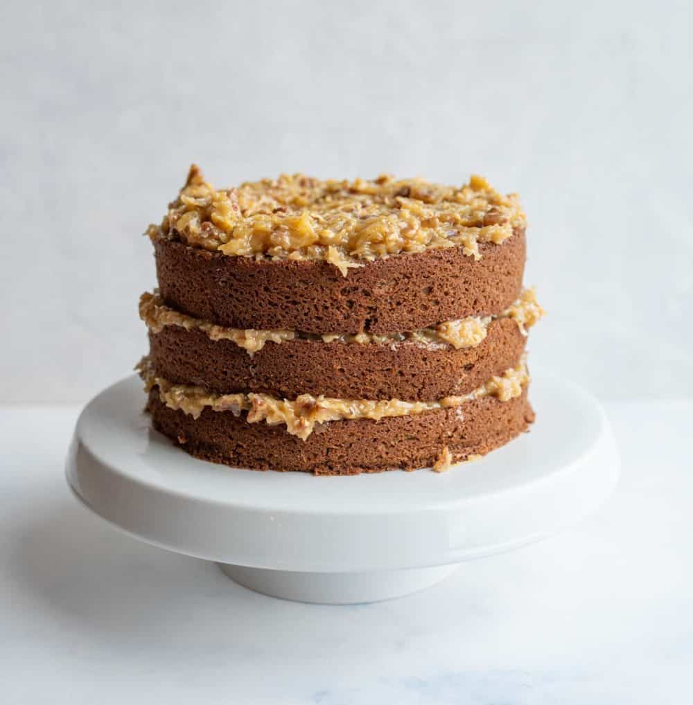 three layered round german chocolate cake with traditional coconut frosting