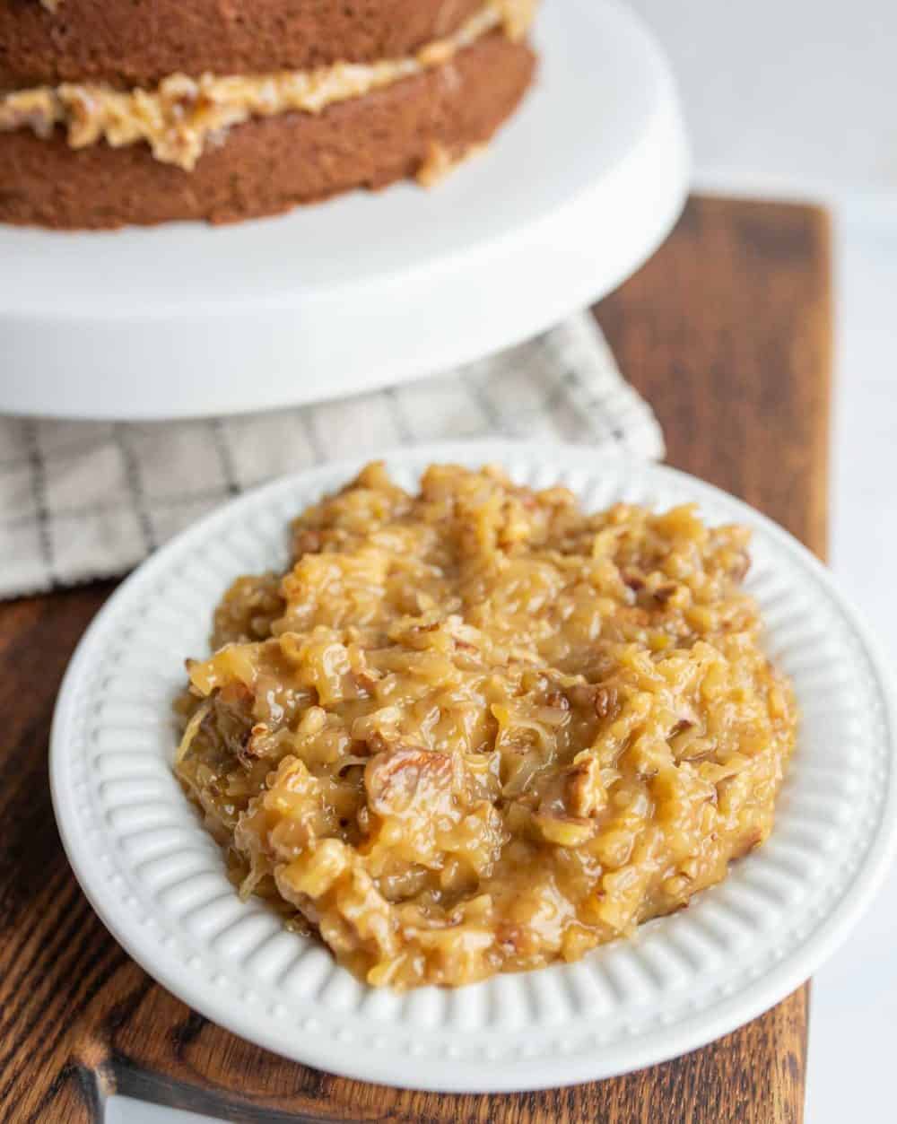 traditional coconut icing for german chocolate cake on a white plate