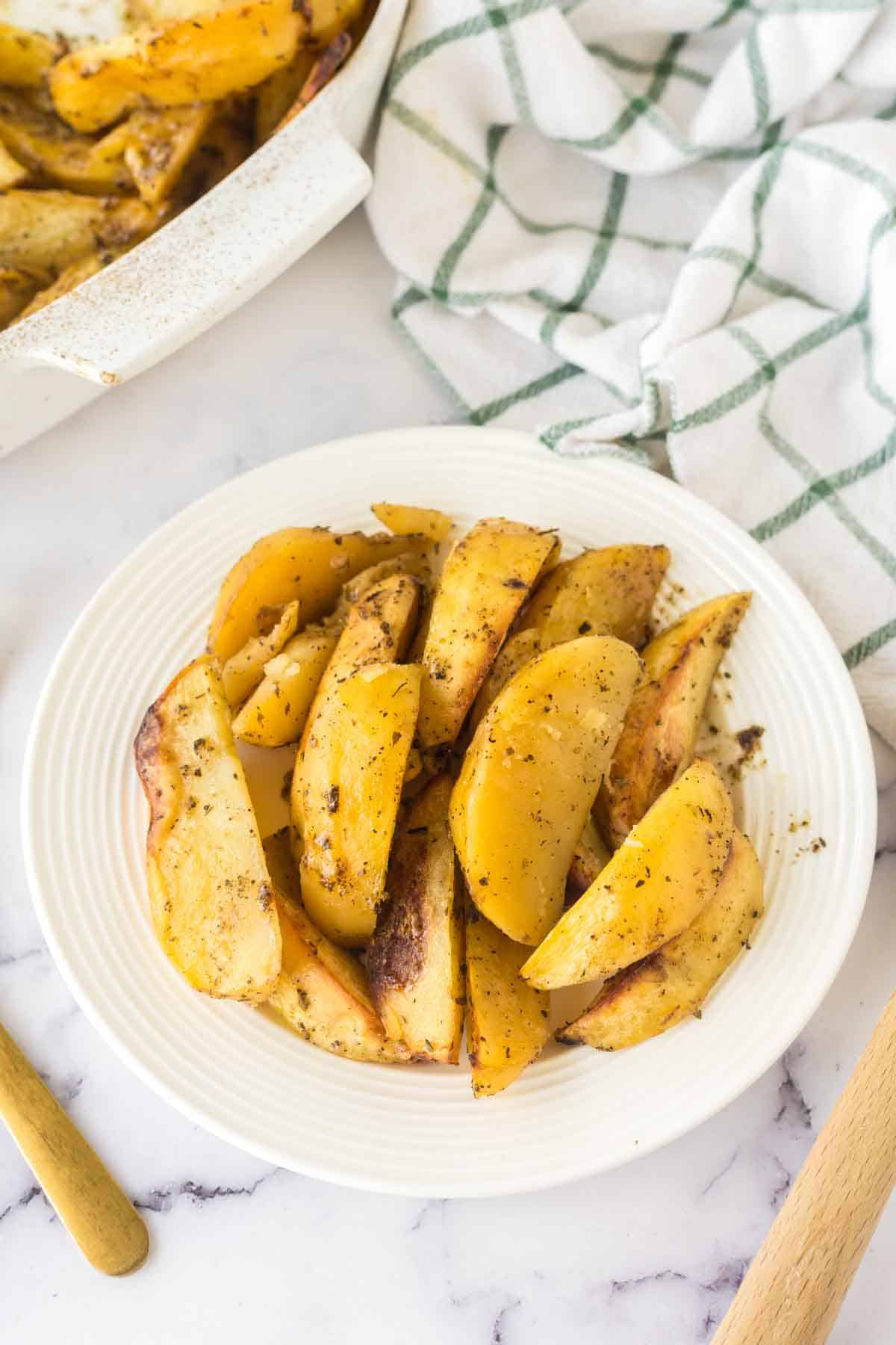 greek wedge potatoes on a plate