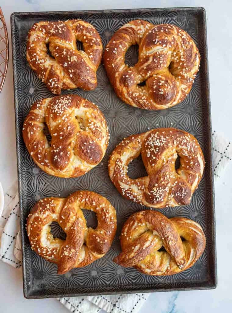 Top view of homemade pretzels on a baking sheet. 