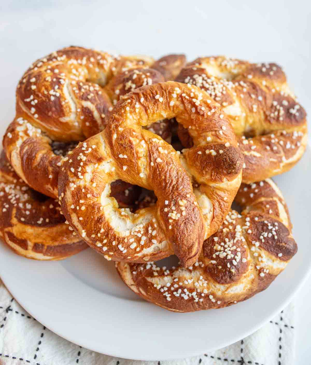Stack of homemade pretzels on a plate.