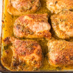 baking dish of baked and seasoned mustard chicken