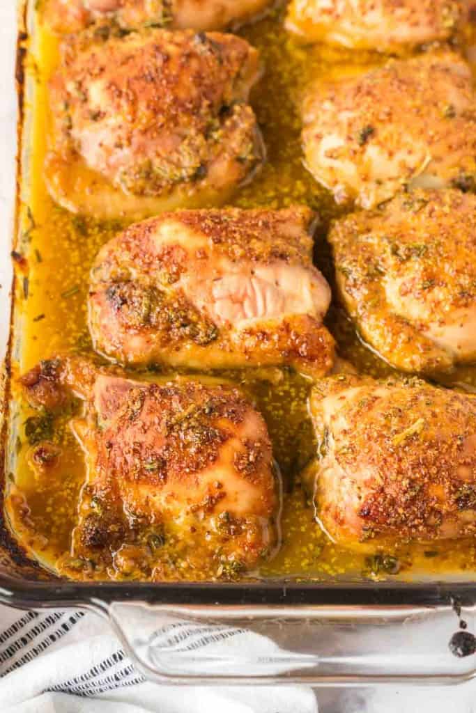 baking dish of baked and seasoned mustard chicken