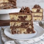 slice of three layered marble cake mixed with vanilla and chocolate cake