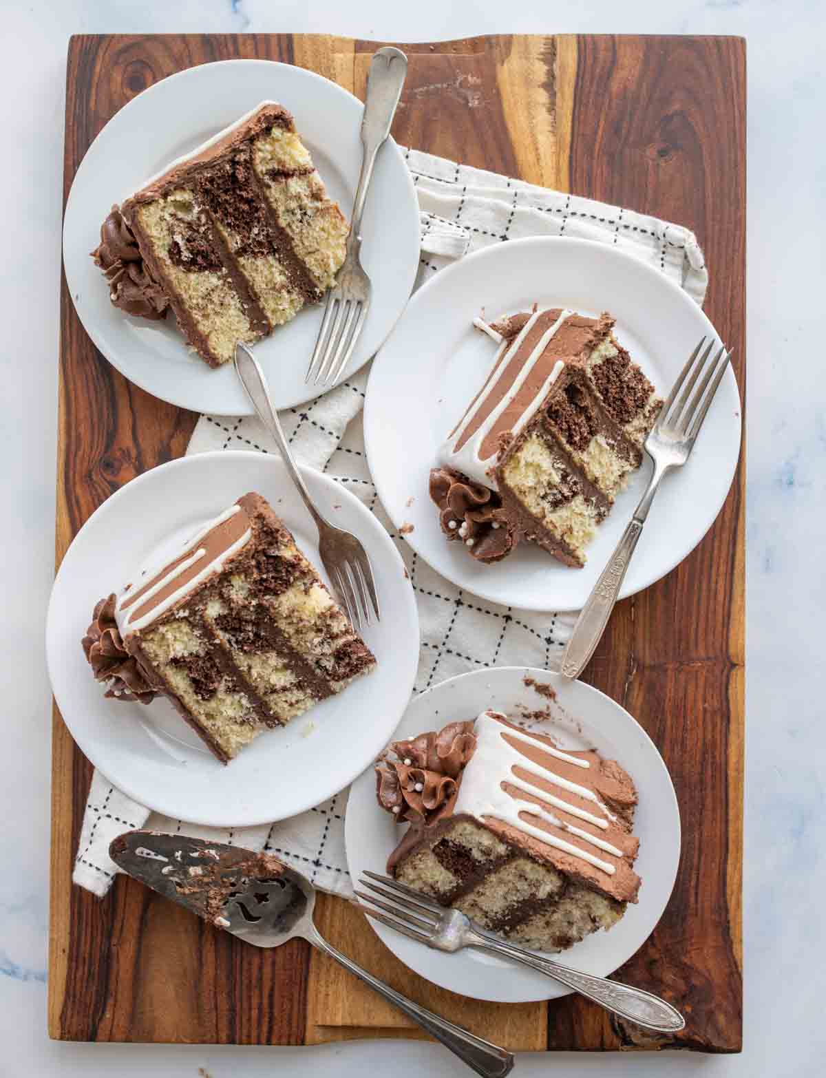 slice of three layered marble cake mixed with vanilla and chocolate cake