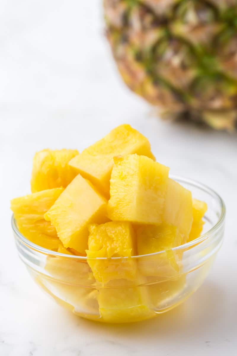 cubes of fresh pineapple in a small glass bowl