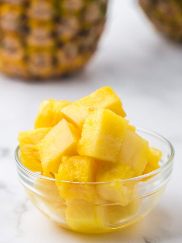 cubes of fresh pineapple in a small glass bowl