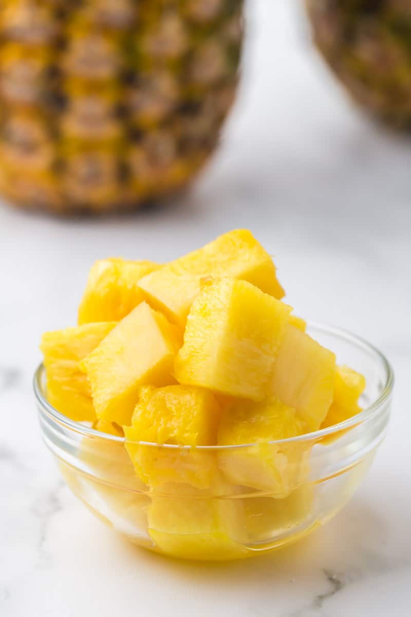 cubes of fresh pineapple in a small glass bowl