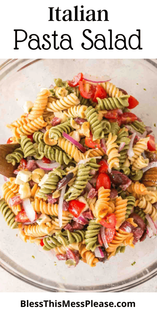 Pin for Italian Pasta salad recipe with images of spiral noodles, onions, tomatoes and kalamata olives in a glass mixing bowl