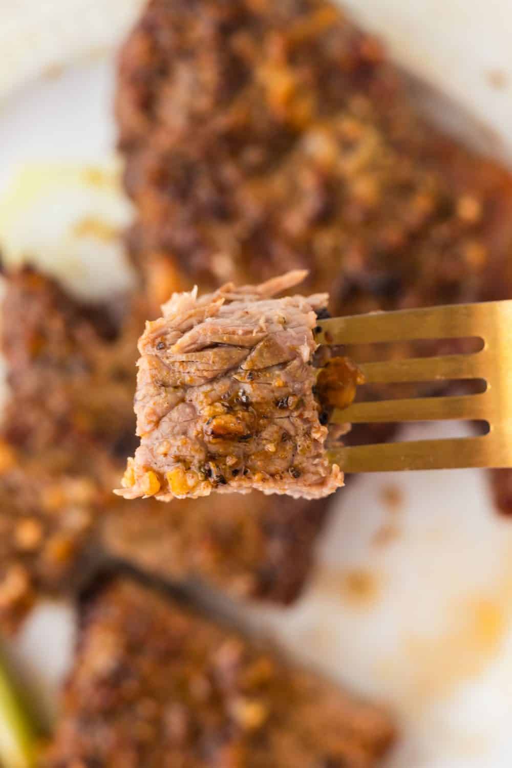 Fork with piece of air fryer steak.