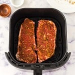 raw seasoned steak in the air fryer