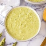 top view aesthetic photo of two bowls of asparagus soup