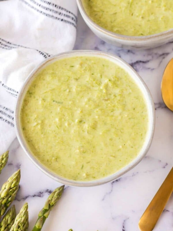 top view aesthetic photo of two bowls of asparagus soup