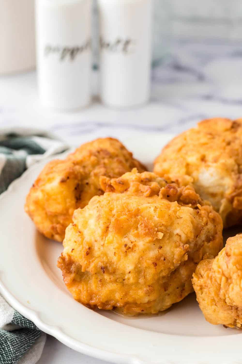 Buttermilk fried chicken on a white plate.