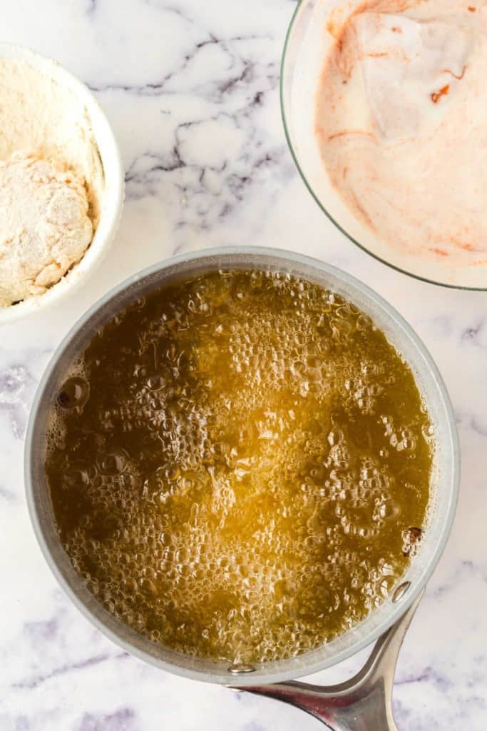 Boiling pot filled with chicken.