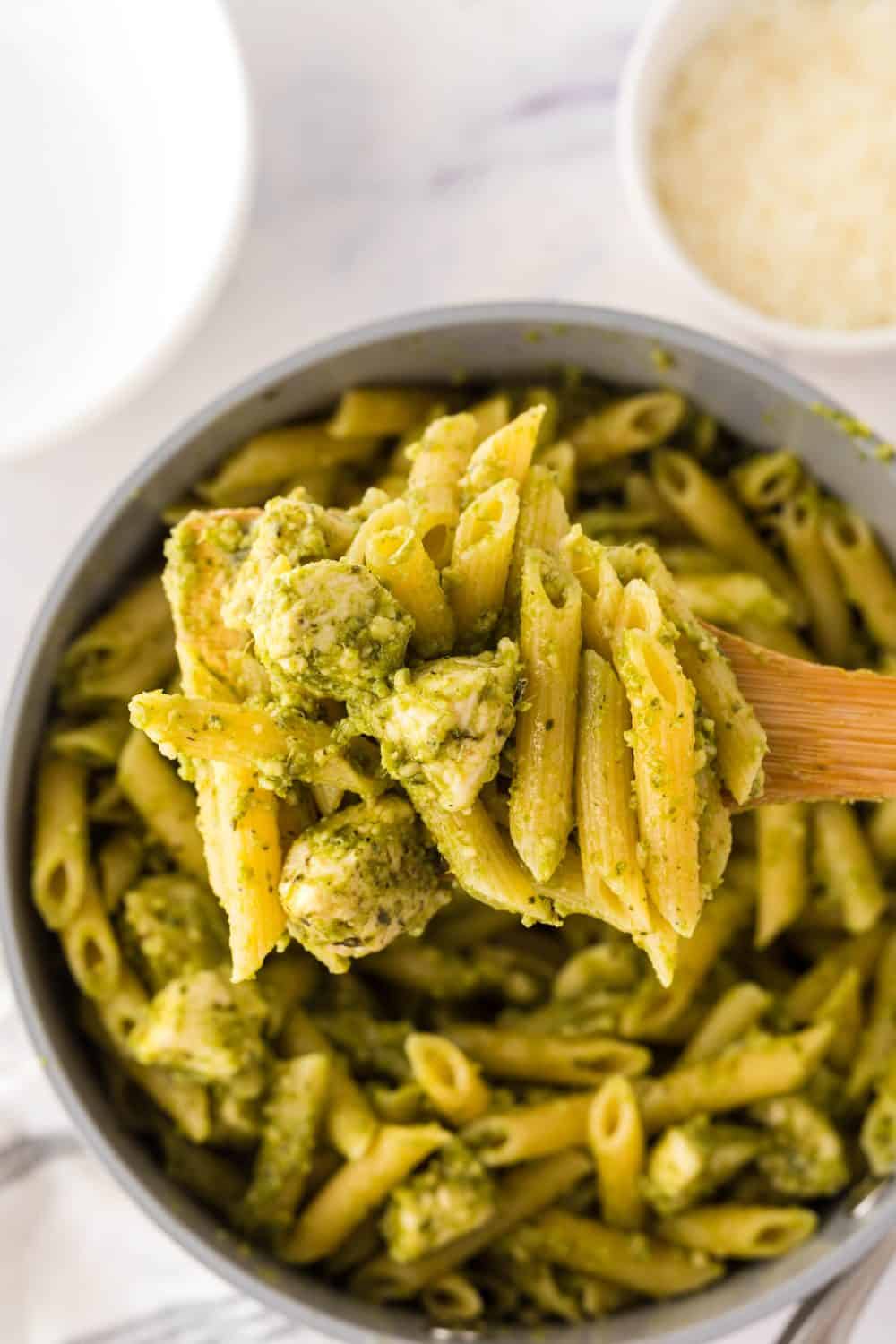 Spoonful of chicken pesto pasta.