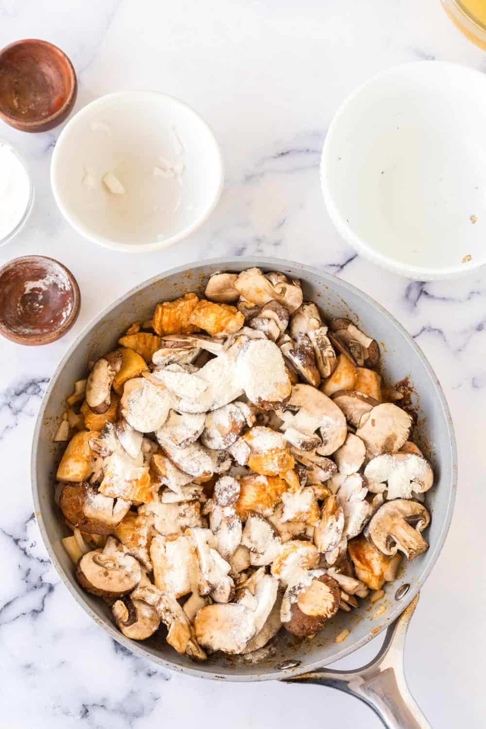 chicken strogonoff ingredients in a pan