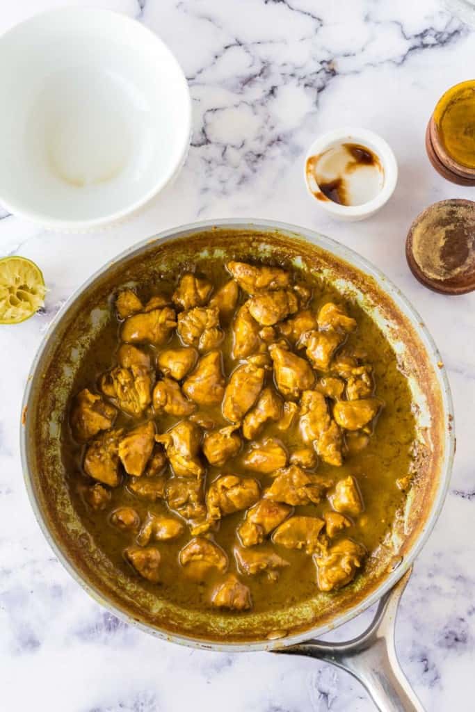 pan full of coconut chicken curry in sauce view from the top
