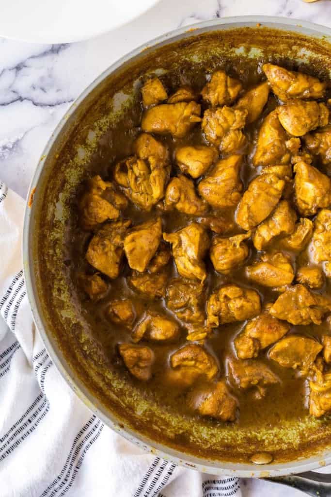 pan full of coconut chicken curry in sauce