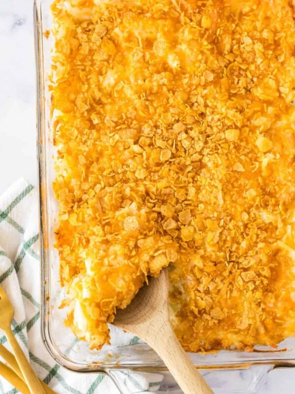 an entire baking dish full of crispy golden funeral potatoes