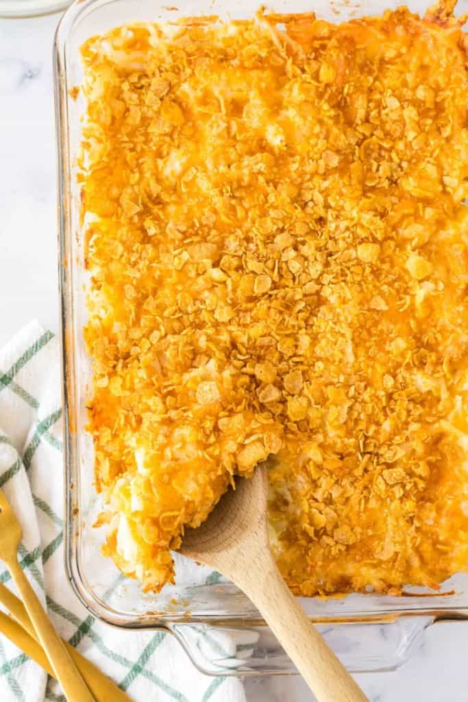 an entire baking dish full of crispy golden funeral potatoes